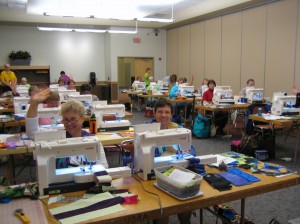 Students sorting through the clues in the mystery quilt class