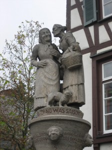 Some things never change -- these stone figures stand as testiment to the practice of sharing news at the local fountain.