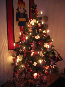 My peppermint themed Christmas tree glows in the early morning light of my sewing studio.