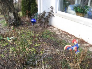 The flower bed in our back yard behind the large picture window